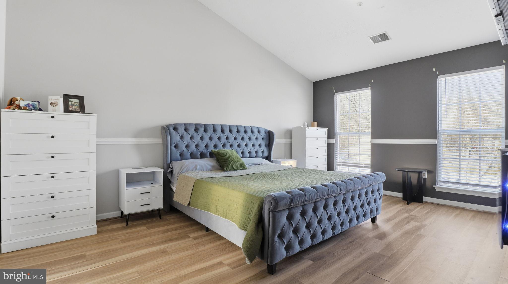 7105 Friendship Road Clinton, MD 20735 - Photo 22 of 42 Serene bedroom with modern elegance.