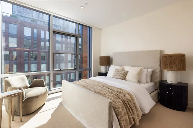a bathroom with a double vanity sink toilet and shower