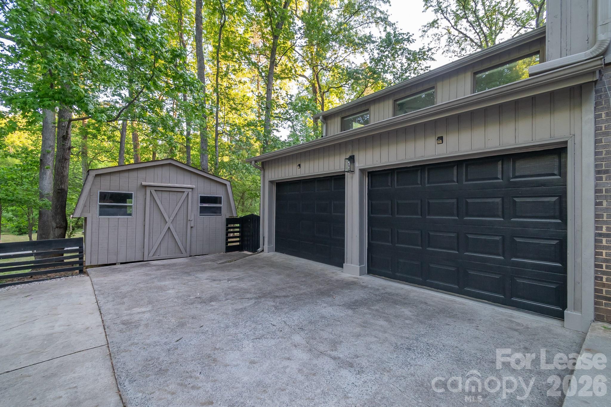3917 Singletree Road Mint Hill, NC 28227 - Photo 11 of 47 a view of a house with a yard and garage