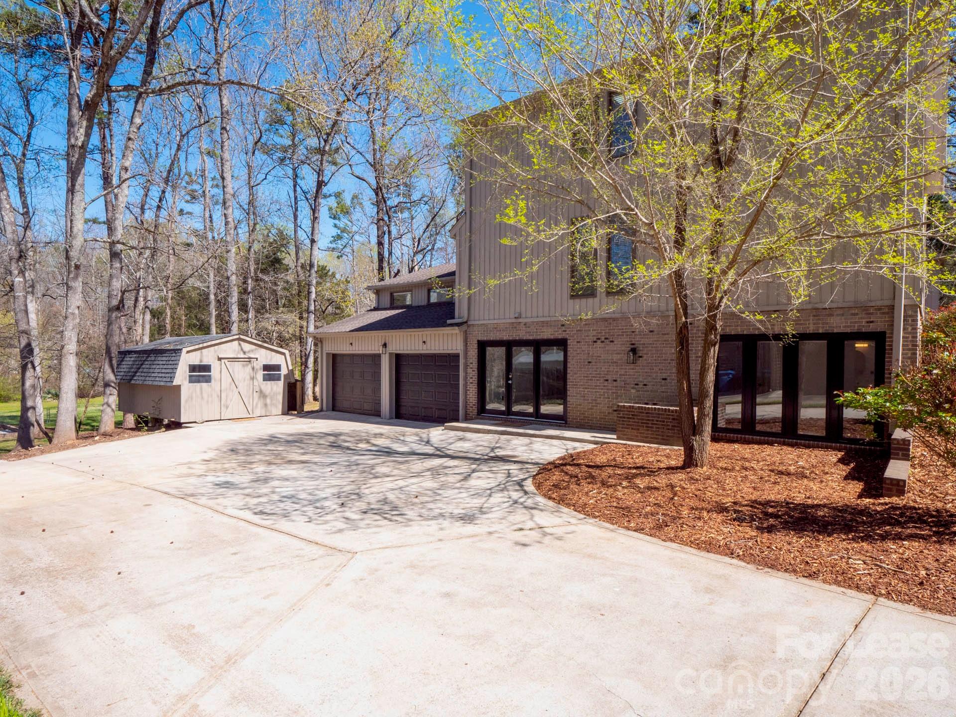 3917 Singletree Road Mint Hill, NC 28227 - Photo 12 of 47 a front view of a house with a yard and garage