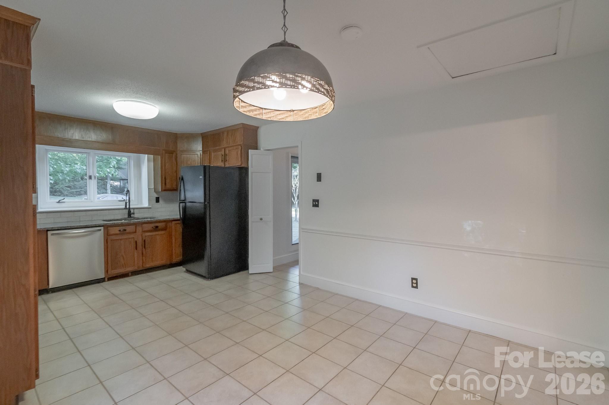 3917 Singletree Road Mint Hill, NC 28227 - Photo 27 of 47 a kitchen with stainless steel appliances a refrigerator and a sink