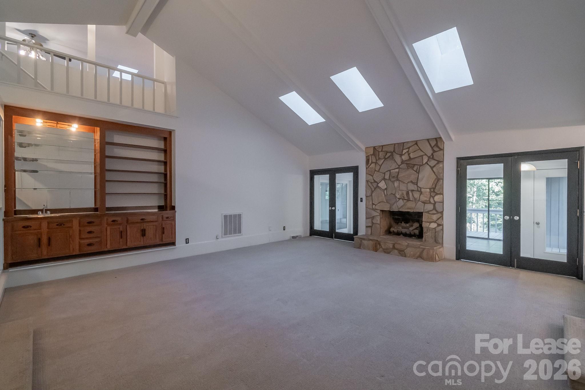 3917 Singletree Road Mint Hill, NC 28227 - Photo 30 of 47 a view of an empty room with a fireplace and a window