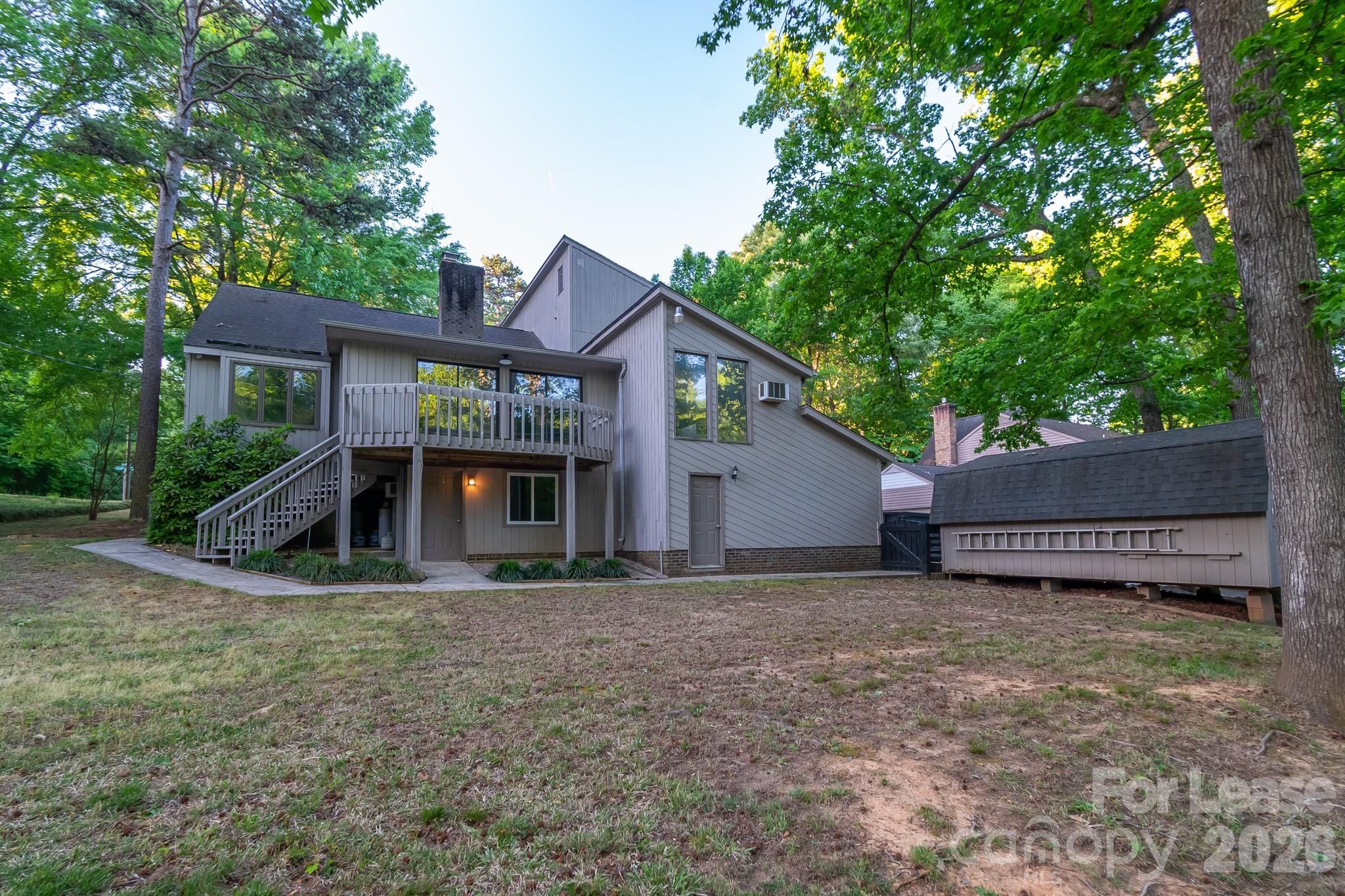 3917 Singletree Road Mint Hill, NC 28227 - Photo 4 of 47 a view of a house with a yard and large tree