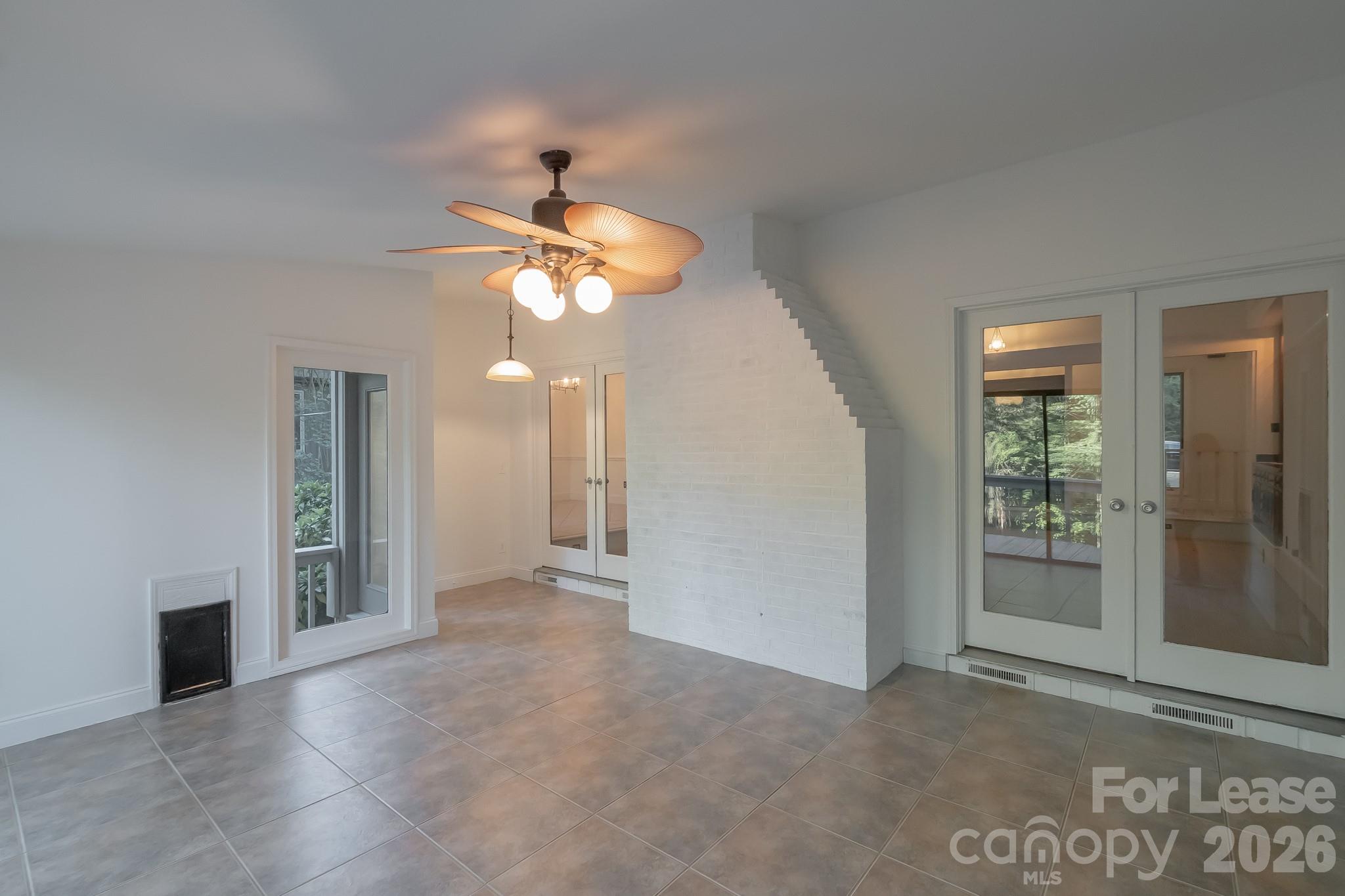 3917 Singletree Road Mint Hill, NC 28227 - Photo 45 of 47 an empty room with chandelier fan and windows