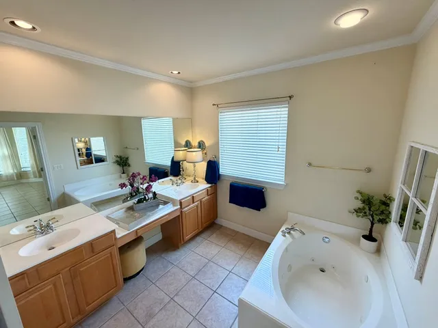 a spacious bathroom with a bathtub and shower