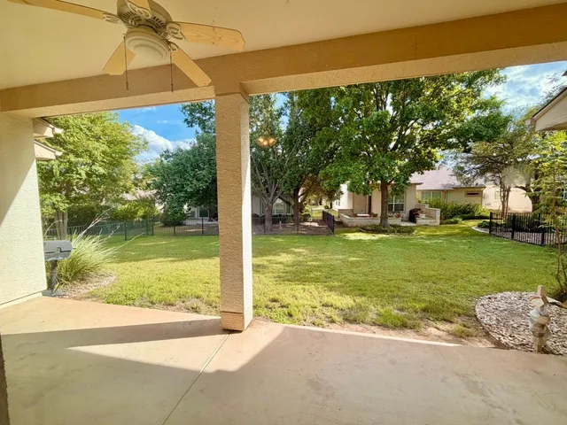 a front view of a building with a garden