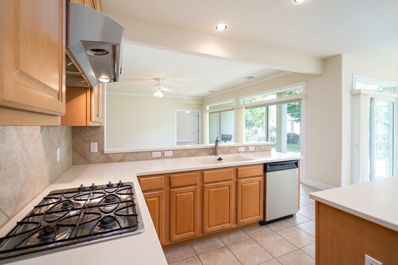 110 Guadalupe Trail Georgetown, TX 78633 - Photo 8 of 27 a kitchen with a sink a stove and refrigerator
