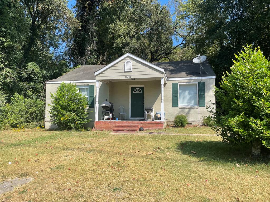 2005 7th Street Columbus, GA 31906 - Photo 1 of 2 a front view of a house with a yard and garage