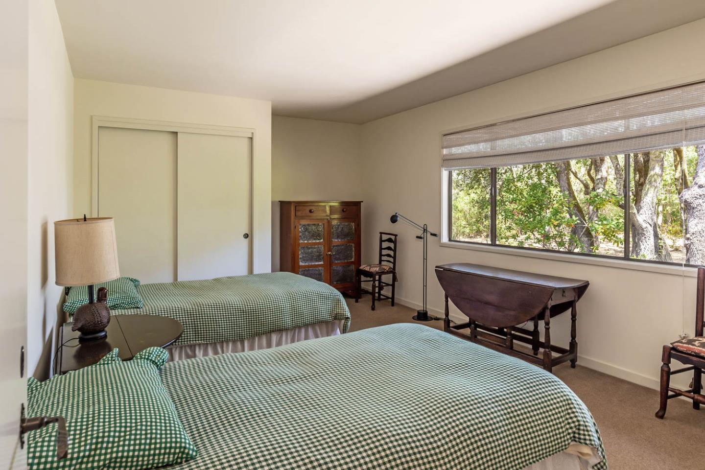 110 Farm Road Woodside, CA 94062 - Photo 20 of 21 a bedroom with a bed and a table