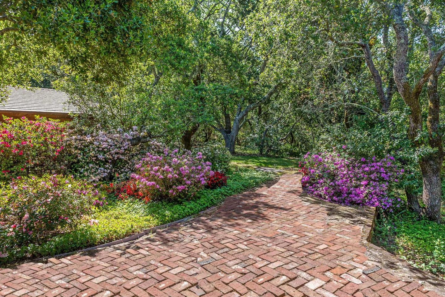 110 Farm Road Woodside, CA 94062 - Photo 7 of 21 a view of a wooden house with a yard and potted plants