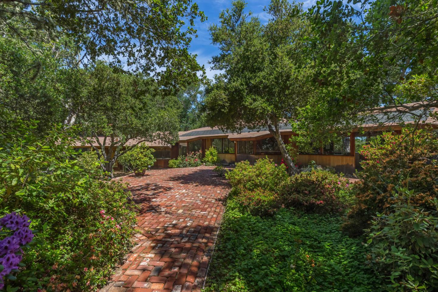 110 Farm Road Woodside, CA 94062 - Photo 8 of 21 a view of a garden with large trees