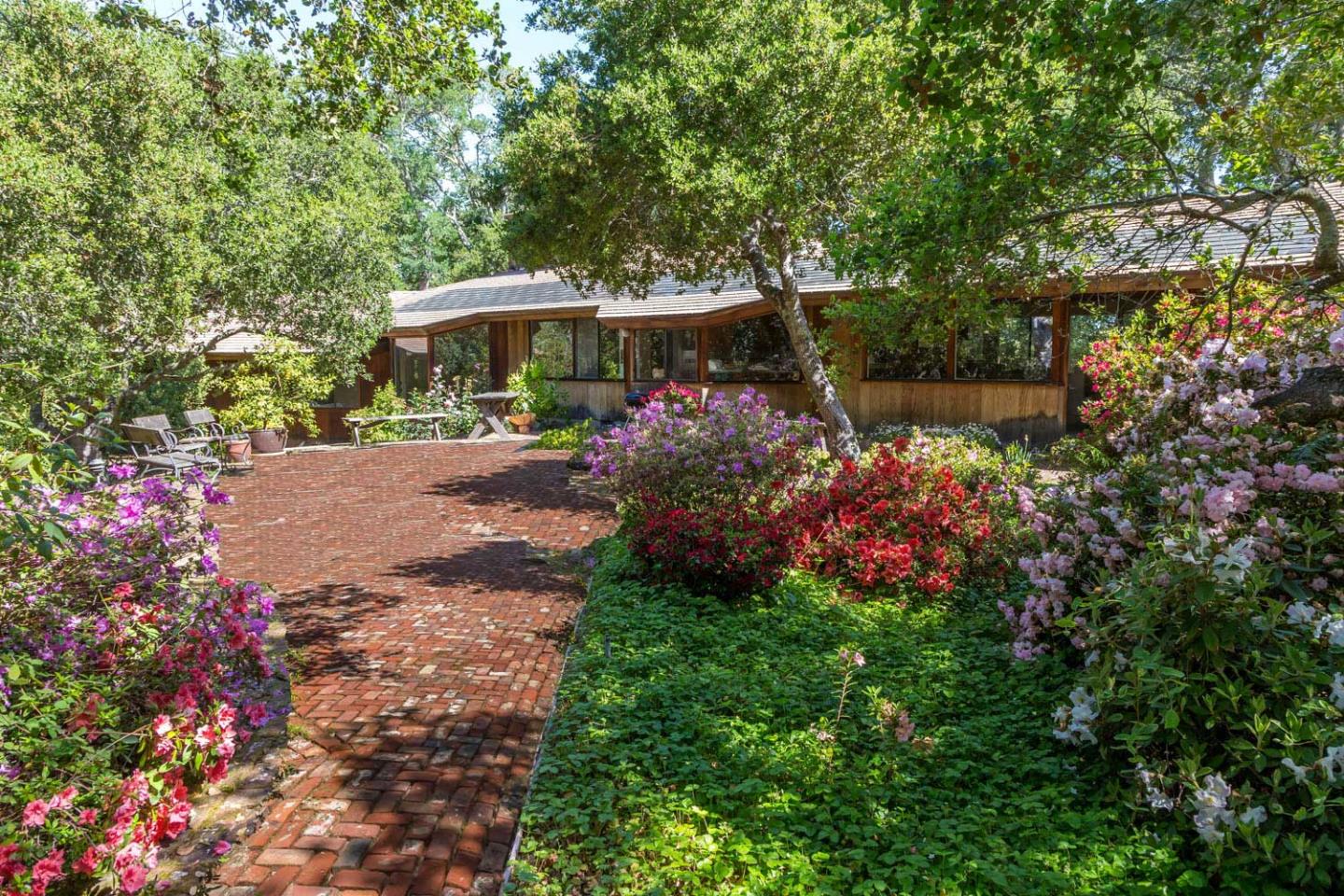 110 Farm Road Woodside, CA 94062 - Photo 9 of 21 a view of a garden with flowers and trees