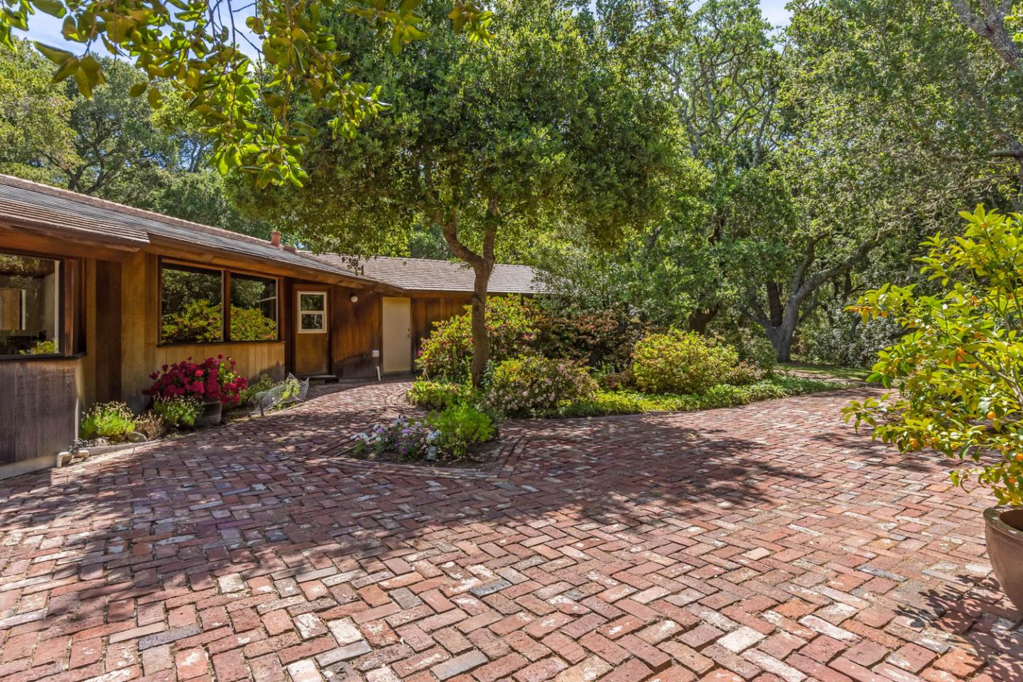 110 Farm Road Woodside, CA 94062 - Photo 10 of 21 a view of a garden with plants and large trees