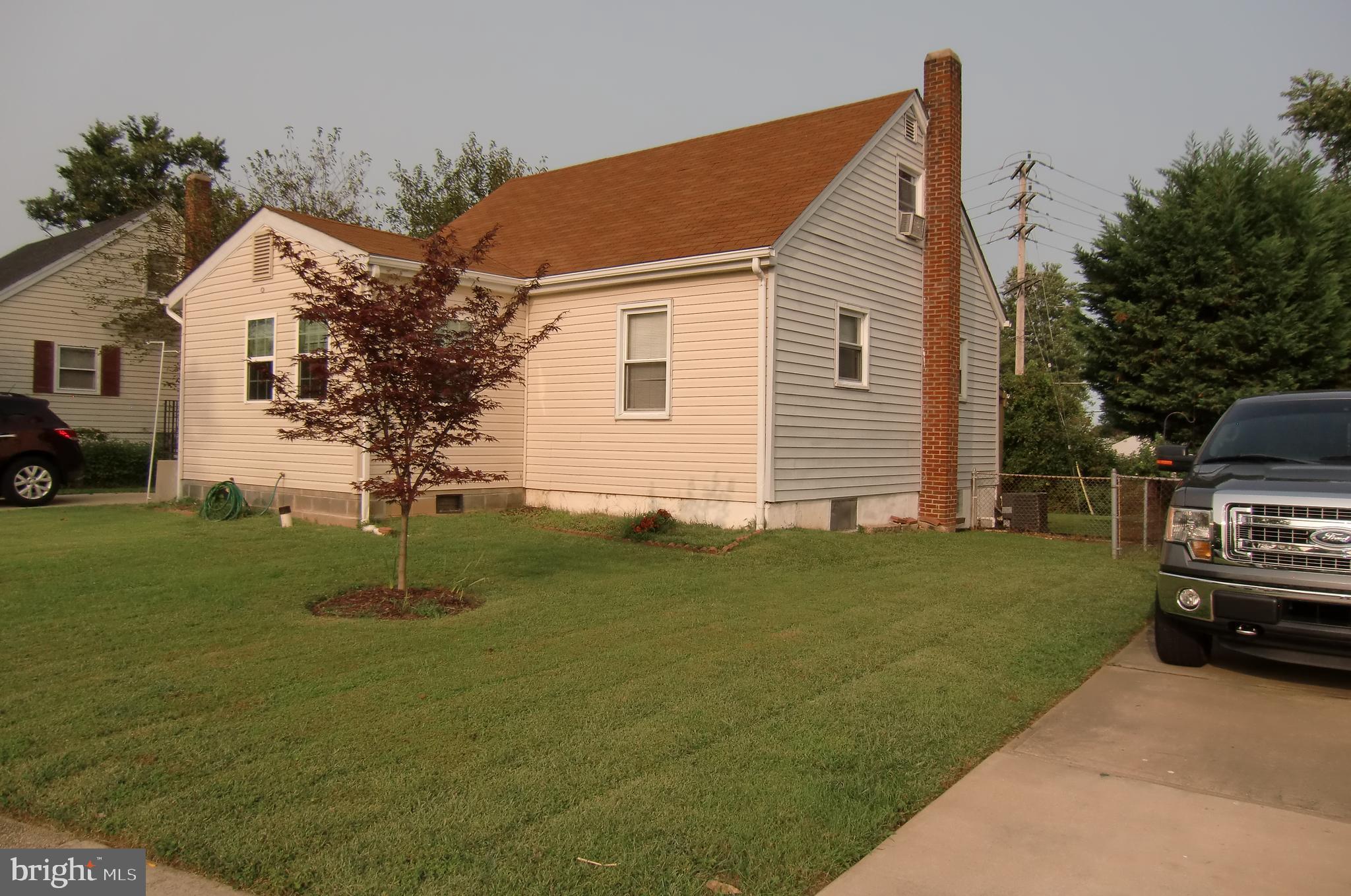 3207 Bryant Avenue Halethorpe, MD 21227 - Photo 2 of 11 a front view of a house with a garden
