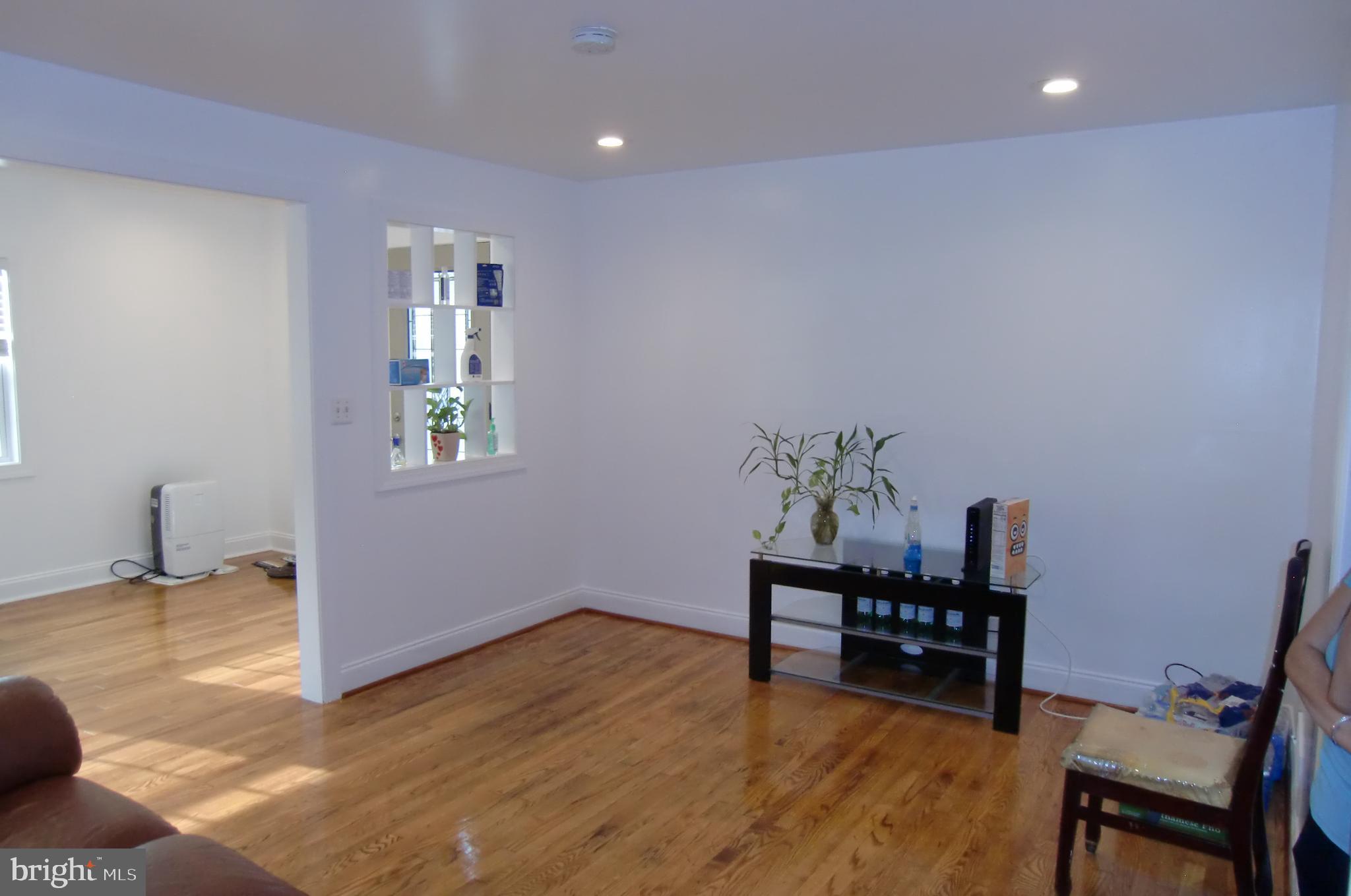 3207 Bryant Avenue Halethorpe, MD 21227 - Photo 4 of 11 a view of a workspace with furniture and wooden floor