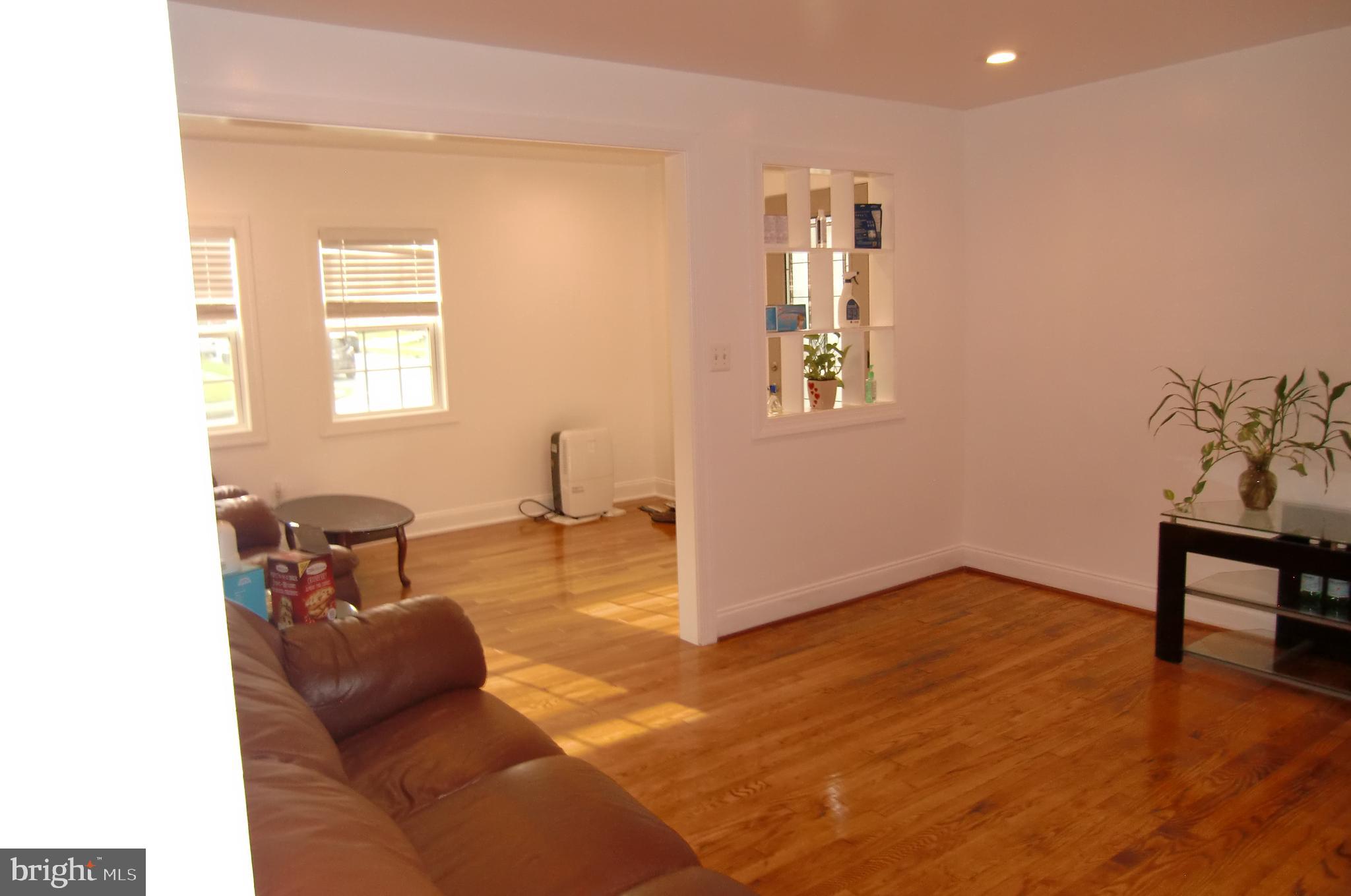 3207 Bryant Avenue Halethorpe, MD 21227 - Photo 5 of 11 a living room with furniture and a window