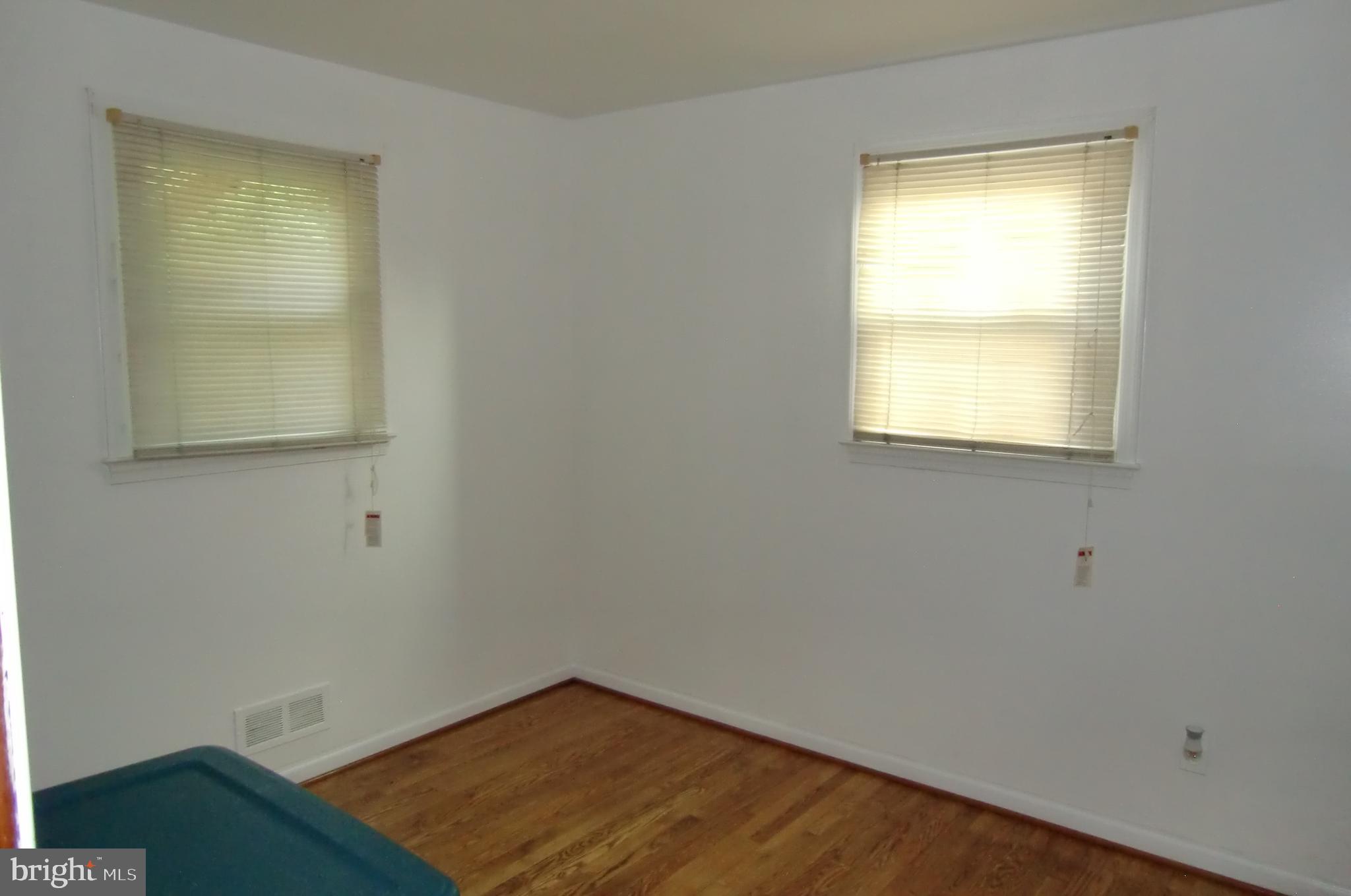 3207 Bryant Avenue Halethorpe, MD 21227 - Photo 6 of 11 an empty room with a window