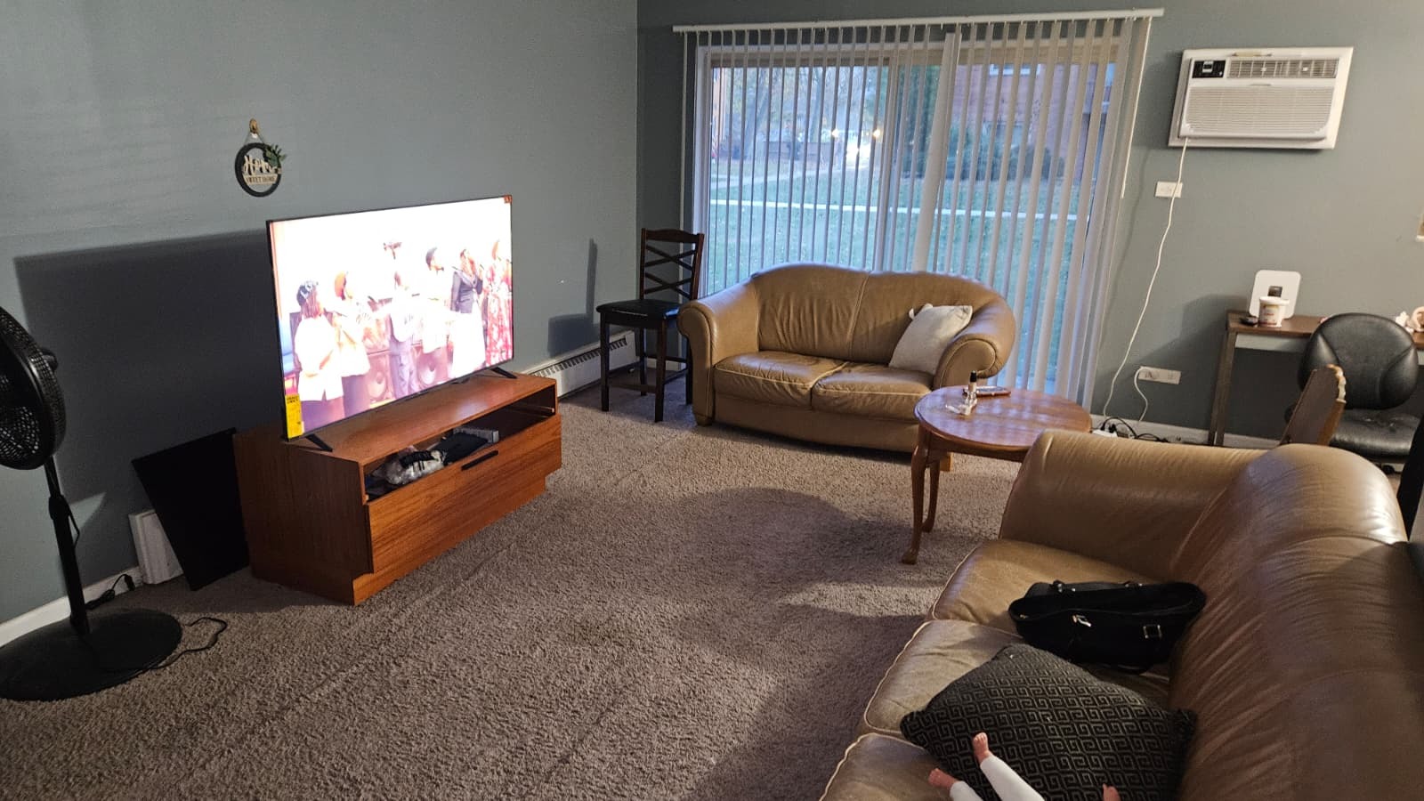 18550 Torrence Avenue, Unit 15 Lansing, IL 60438 - Photo 4 of 12 a living room with furniture and a flat screen tv