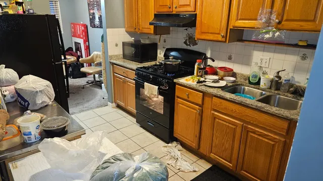 a kitchen with stainless steel appliances granite countertop a stove and a refrigerator
