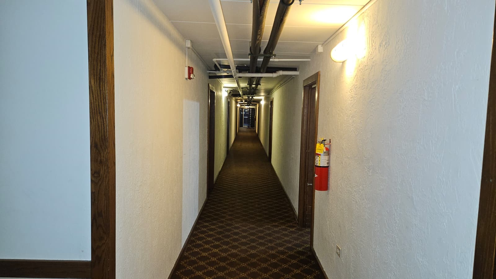 18550 Torrence Avenue, Unit 15 Lansing, IL 60438 - Photo 9 of 12 a view of a hallway with wooden floor and staircase