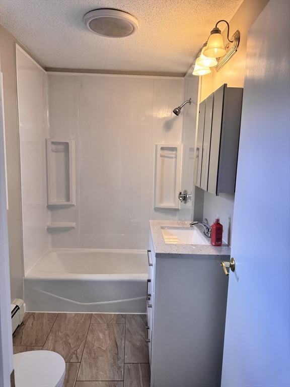 66 Taylor Street, Unit 2 Holyoke, MA 01040 - Photo 16 of 29 a bathroom with a sink and a mirror