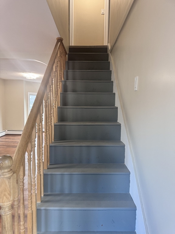 66 Taylor Street, Unit 2 Holyoke, MA 01040 - Photo 22 of 29 a view of staircase with white walls