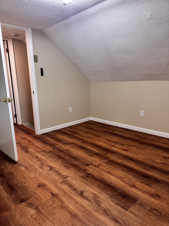 66 Taylor Street, Unit 2 Holyoke, MA 01040 - Photo 25 of 29 a view of empty room with wooden floor