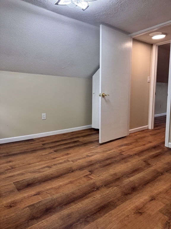 66 Taylor Street, Unit 2 Holyoke, MA 01040 - Photo 27 of 29 a view of empty room with wooden floor