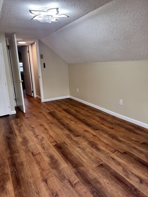 66 Taylor Street, Unit 2 Holyoke, MA 01040 - Photo 28 of 29 a view of empty room with wooden floor