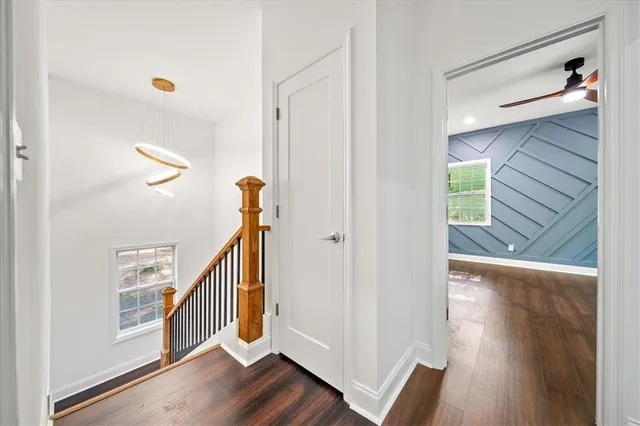 a view of an entryway with wooden floor