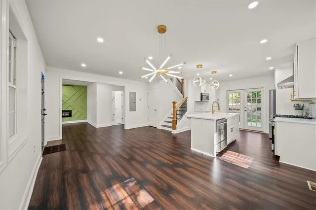 a view of kitchen with cabinets and wooden floor
