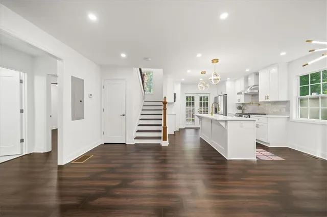 a view of kitchen with furniture and wooden floor