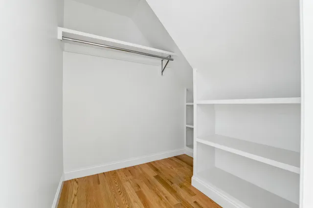 a view of an empty walk in closet