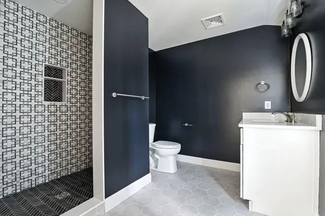 a bathroom with a sink and a toilet