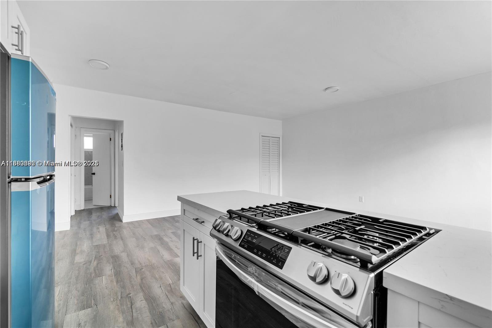 780 73rd Street, Unit 7 Miami Beach, FL 33141 - Photo 2 of 8 a stove top oven sitting inside of a kitchen