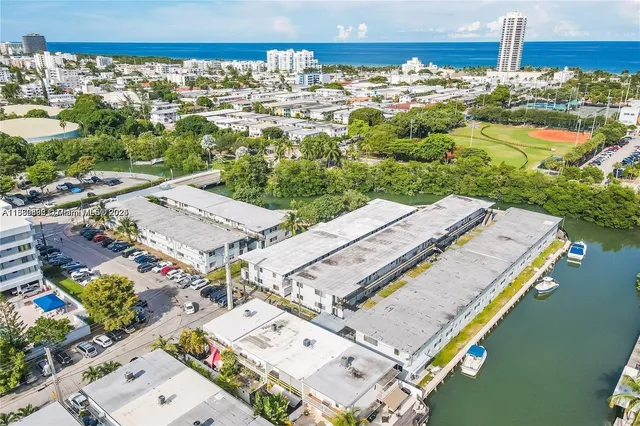 an aerial view of a house with a ocean view