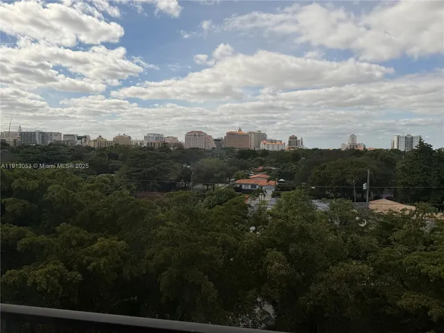 a view of a city with lots of trees