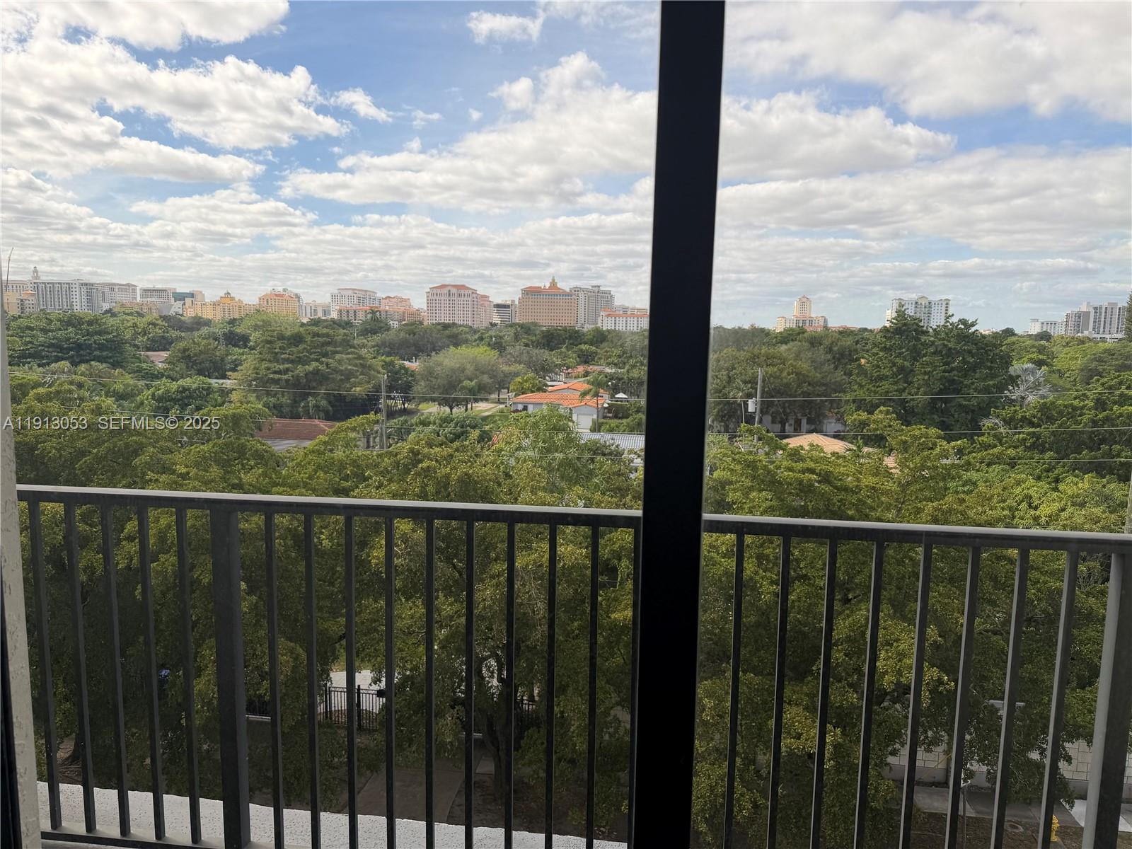 1801 Southwest 32nd Avenue, Unit 504 Miami, FL 33145 - Photo 6 of 14 a view of a balcony with city view