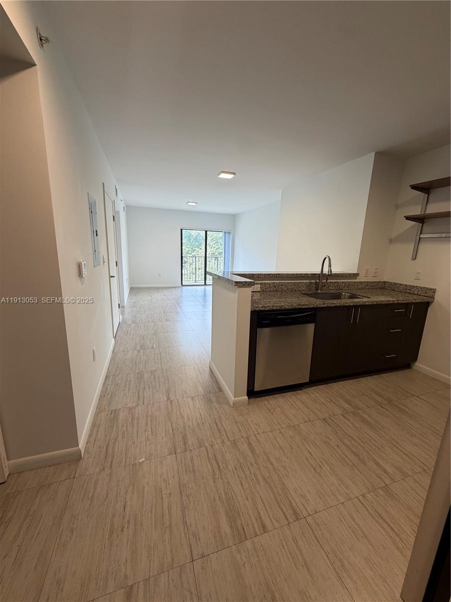 1801 Southwest 32nd Avenue, Unit 504 Miami, FL 33145 - Photo 7 of 14 a living room with hard wood floors and a fireplace