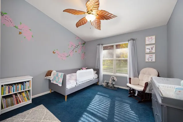 a hallway with cabinet and wooden floor
