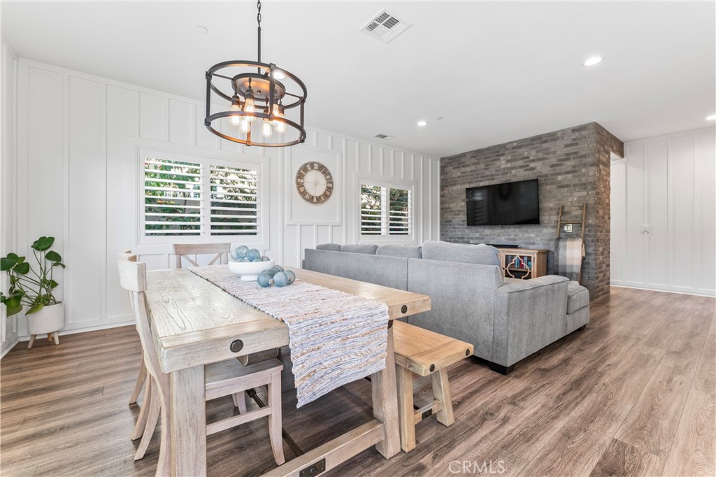 35114 Persano Place Fallbrook, CA 92028 - Photo 11 of 45 a view of a dining room with furniture window and wooden floor