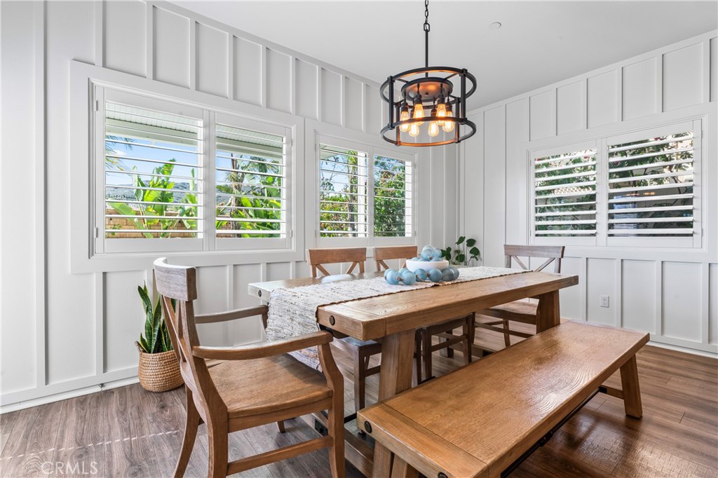 35114 Persano Place Fallbrook, CA 92028 - Photo 13 of 45 a view of a dining room with furniture window and wooden floor