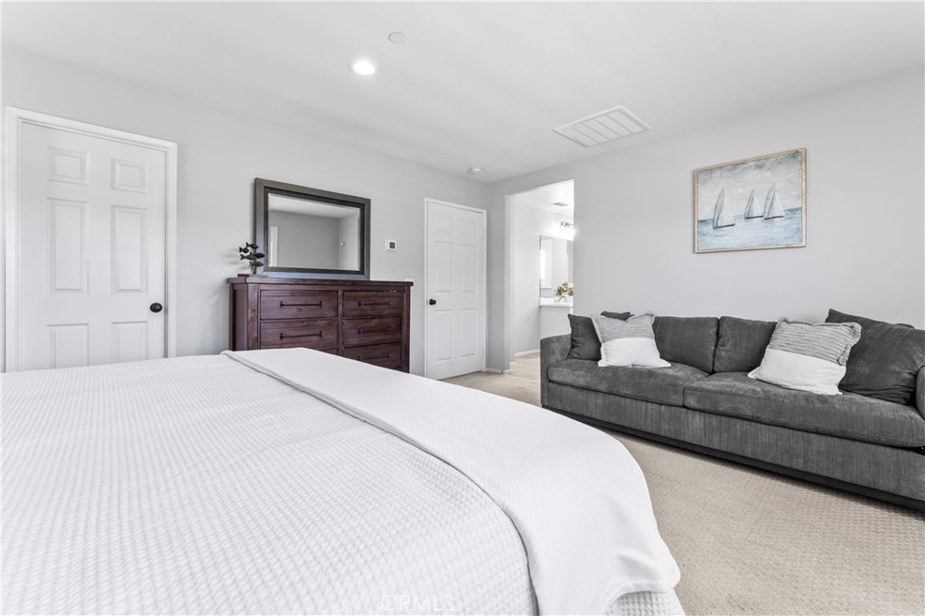 35114 Persano Place Fallbrook, CA 92028 - Photo 20 of 45 a bedroom with a bed and a couch