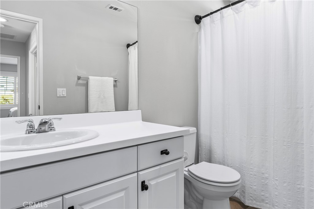 35114 Persano Place Fallbrook, CA 92028 - Photo 26 of 45 a bathroom with a sink and a toilet