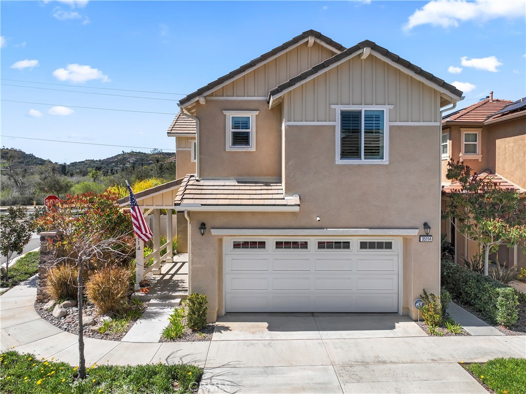 35114 Persano Place Fallbrook, CA 92028 - Photo 36 of 45 a front view of a house with a yard and garage