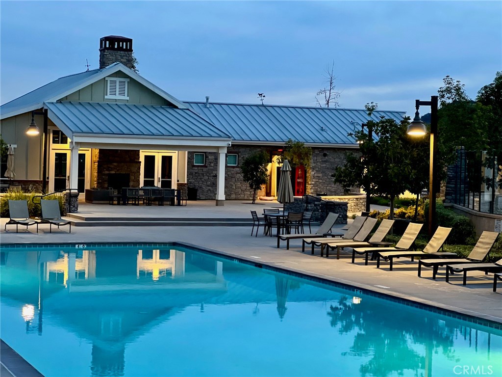 35114 Persano Place Fallbrook, CA 92028 - Photo 7 of 45 a view of a swimming pool with outdoor seating