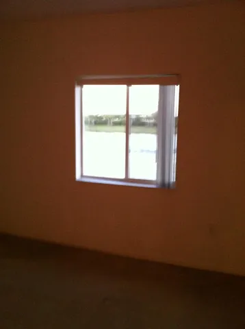 a view of a room that has a window in it