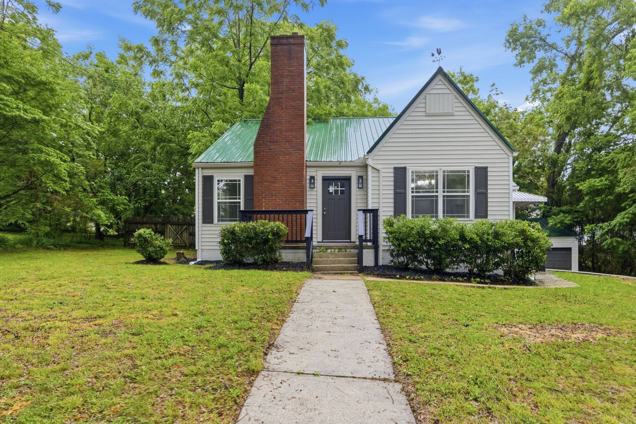 305 South Irwin Street Manchester, TN 37355 - Photo 1 of 40 a front view of a house with garden