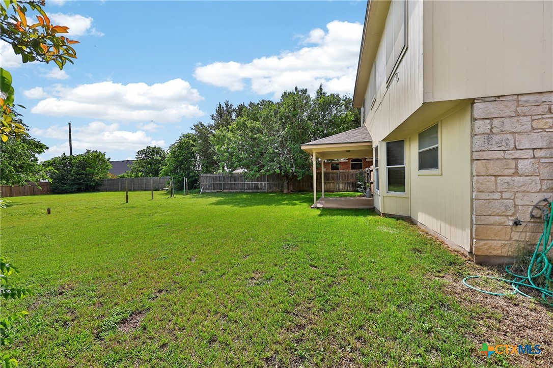 7015 Rickey Drive Temple, TX 76502 - Photo 27 of 29 a view of a house with backyard and a tree