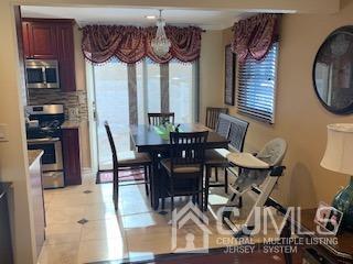 344 Union Avenue Middlesex, NJ 08846 - Photo 8 of 22 a view of a dining room with furniture window and wooden floor